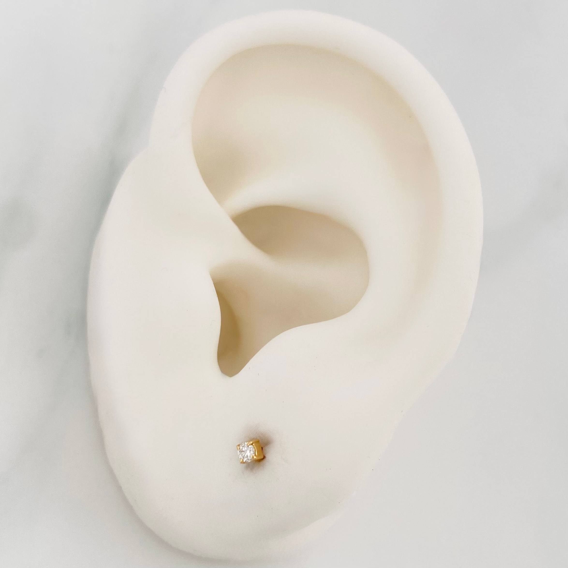 Topos Garra diamantes 0.6pts diamante 1pts Diamante 1pts 0.5g / 1.83mm Oro Amarillo 18K