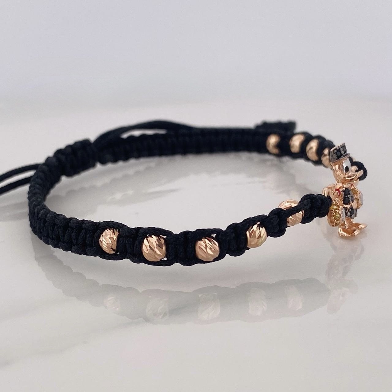 Pulsera Tejida Negra Pato Bolsa de Dinero Tres Oros 18K
