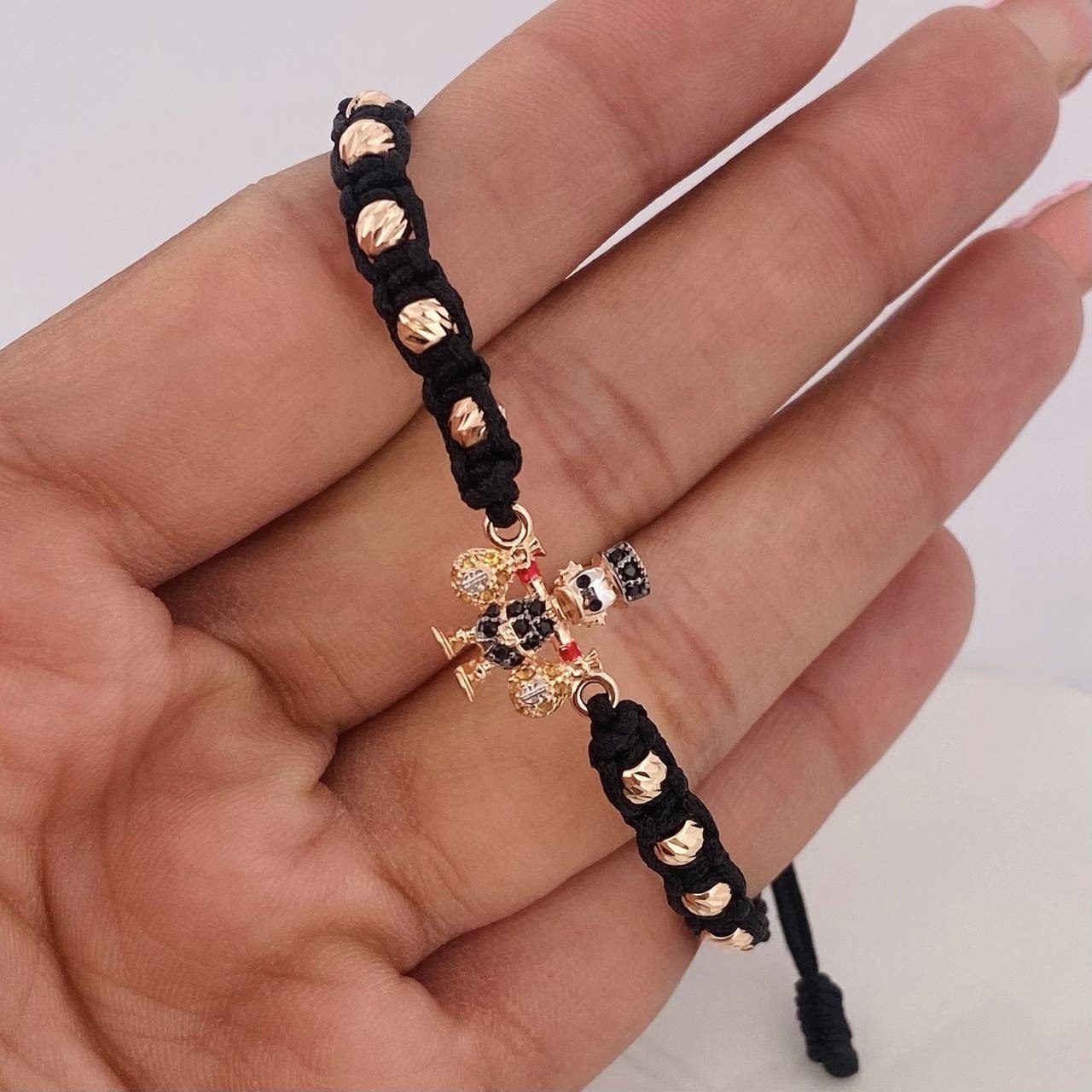 Pulsera Tejida Negra Pato Bolsa de Dinero Tres Oros 18K