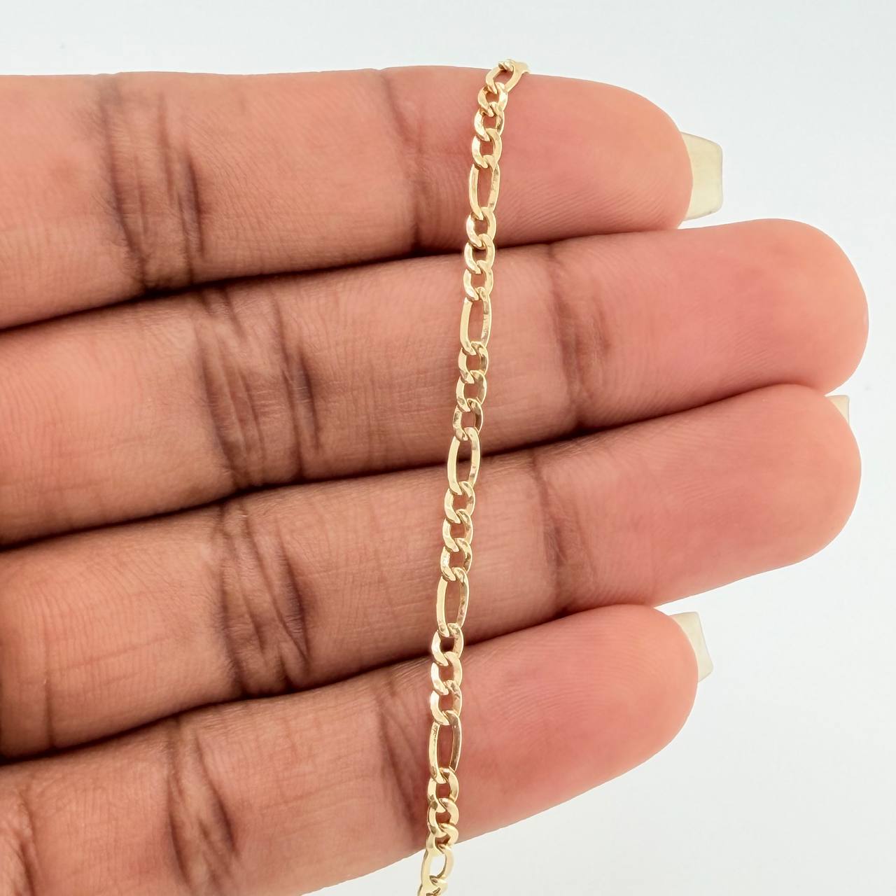 Pulso Figaro 1.4gr / 19cm / 2.2mm Oro Amarillo +1 18K $