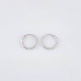 Candongas Mini Aro Liso 0.35gr / 9mm Oro Blanco 18K