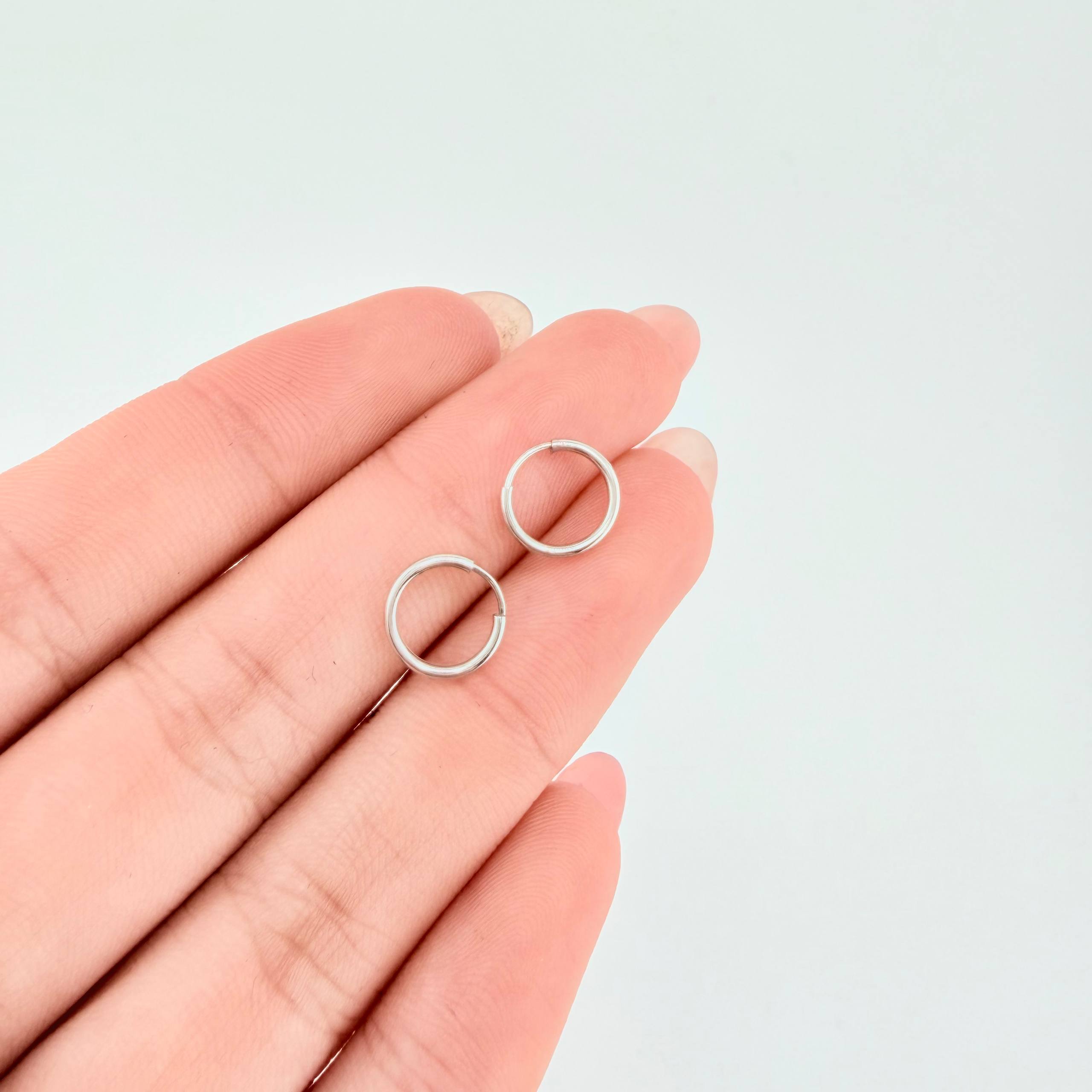 Candongas Mini Aro Liso 0.35gr / 9mm Oro Blanco 18K