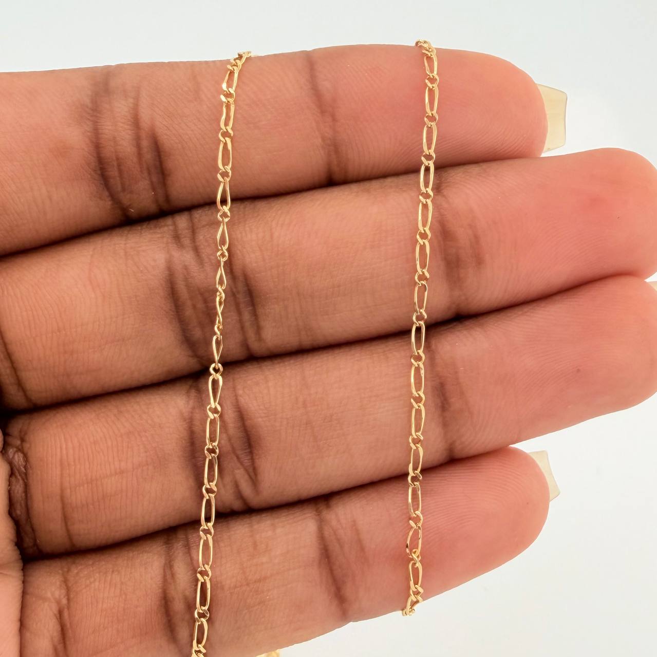 Cadena Figaro Seguido  2.5gr / 60.9cm / 1.43mm Oro Amarillo +1 18K $