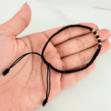 Pulsera Tejida Negra Bolas Diamantadas 3mm Oro Amarillo 18K