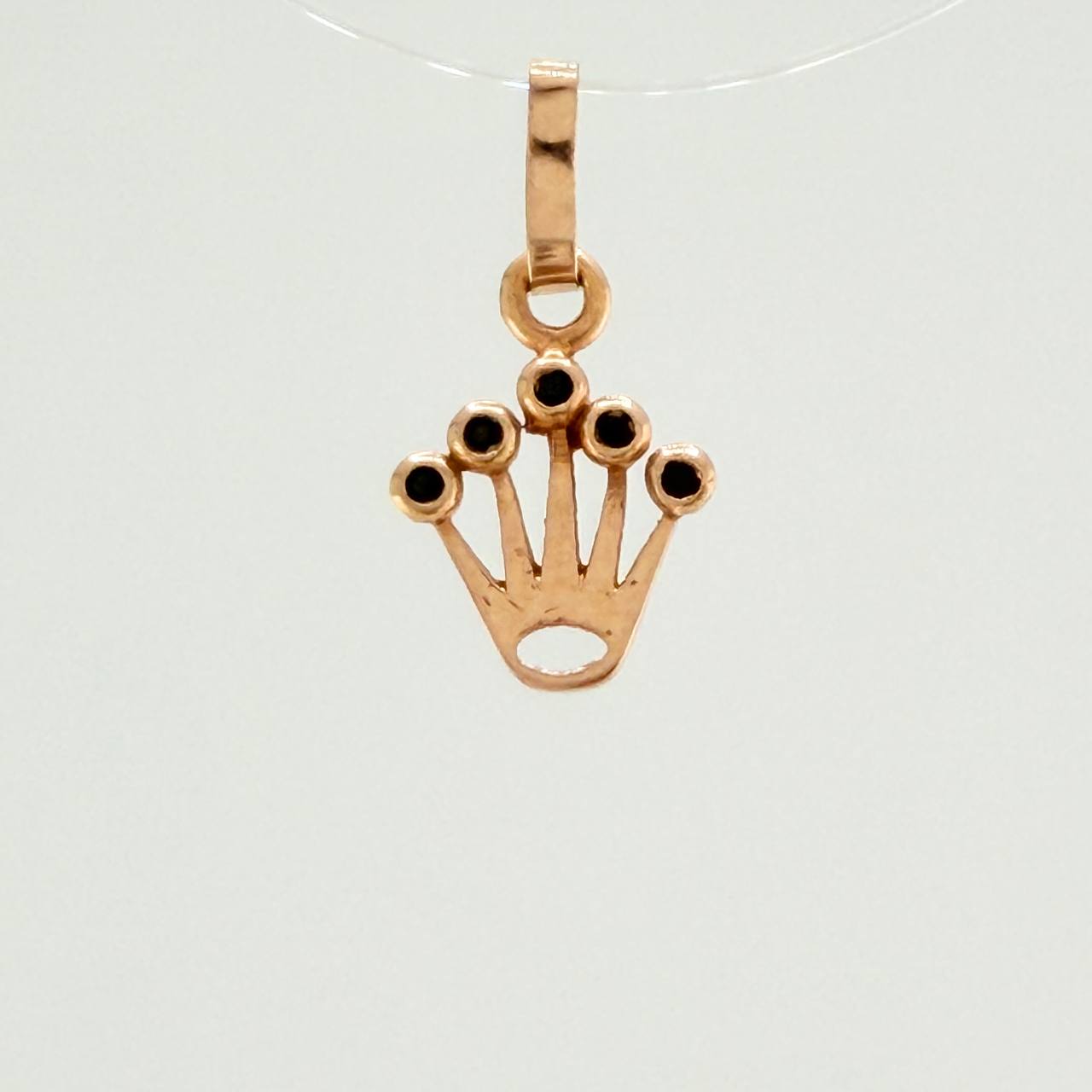 Dije Corona RX 0.4gr / 1.5cm / Circones Negros  Oro Rosa$