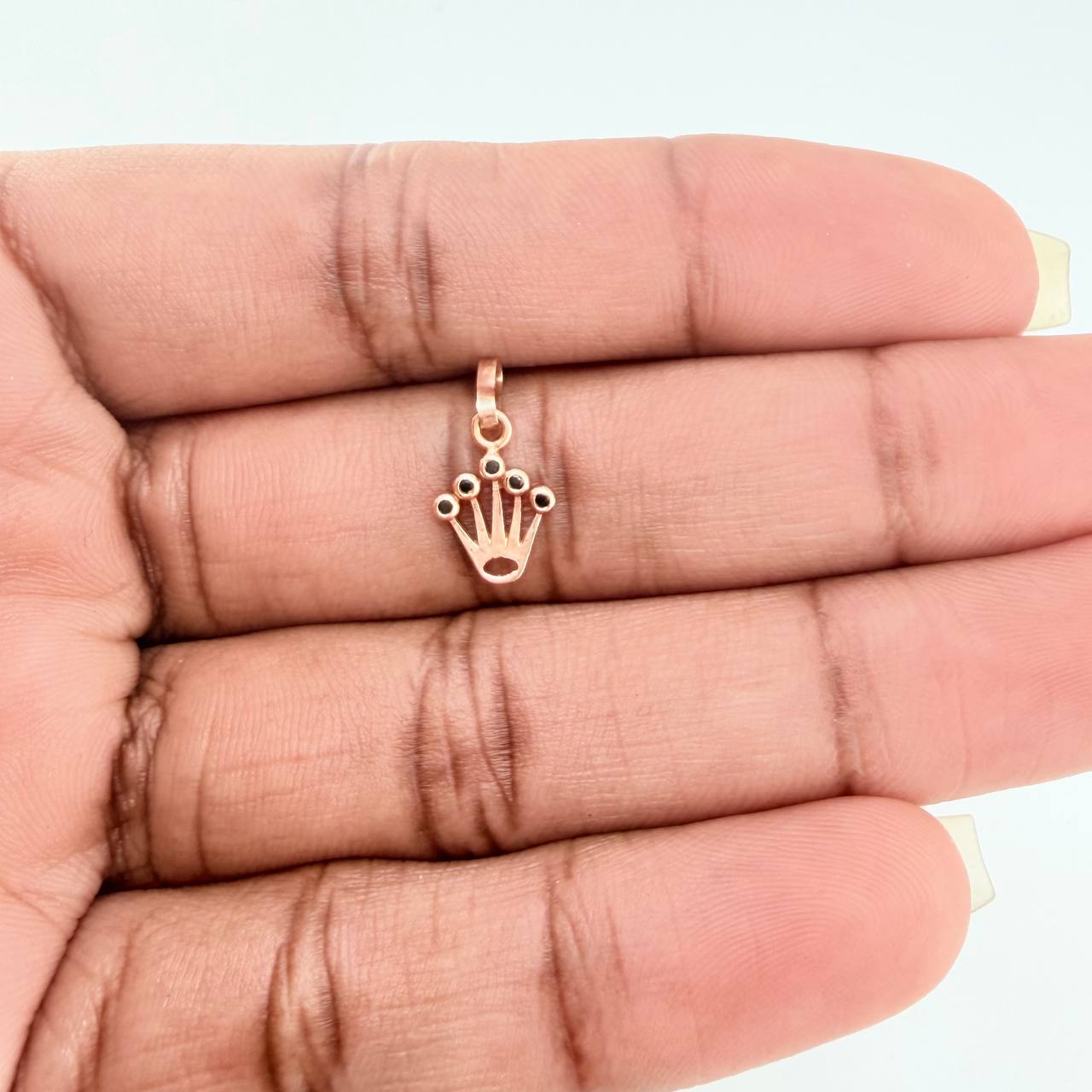 Dije Corona RX 0.4gr / 1.5cm / Circones Negros  Oro Rosa$