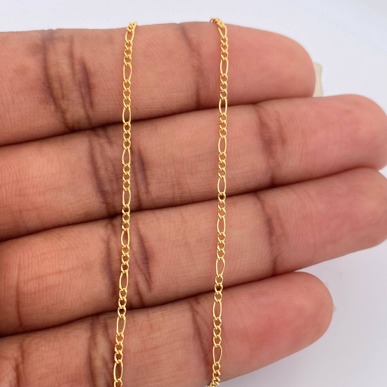 Cadena Figaro 1.05gr / 45cm / 1.35mm Oro Amarillo +1 18K $