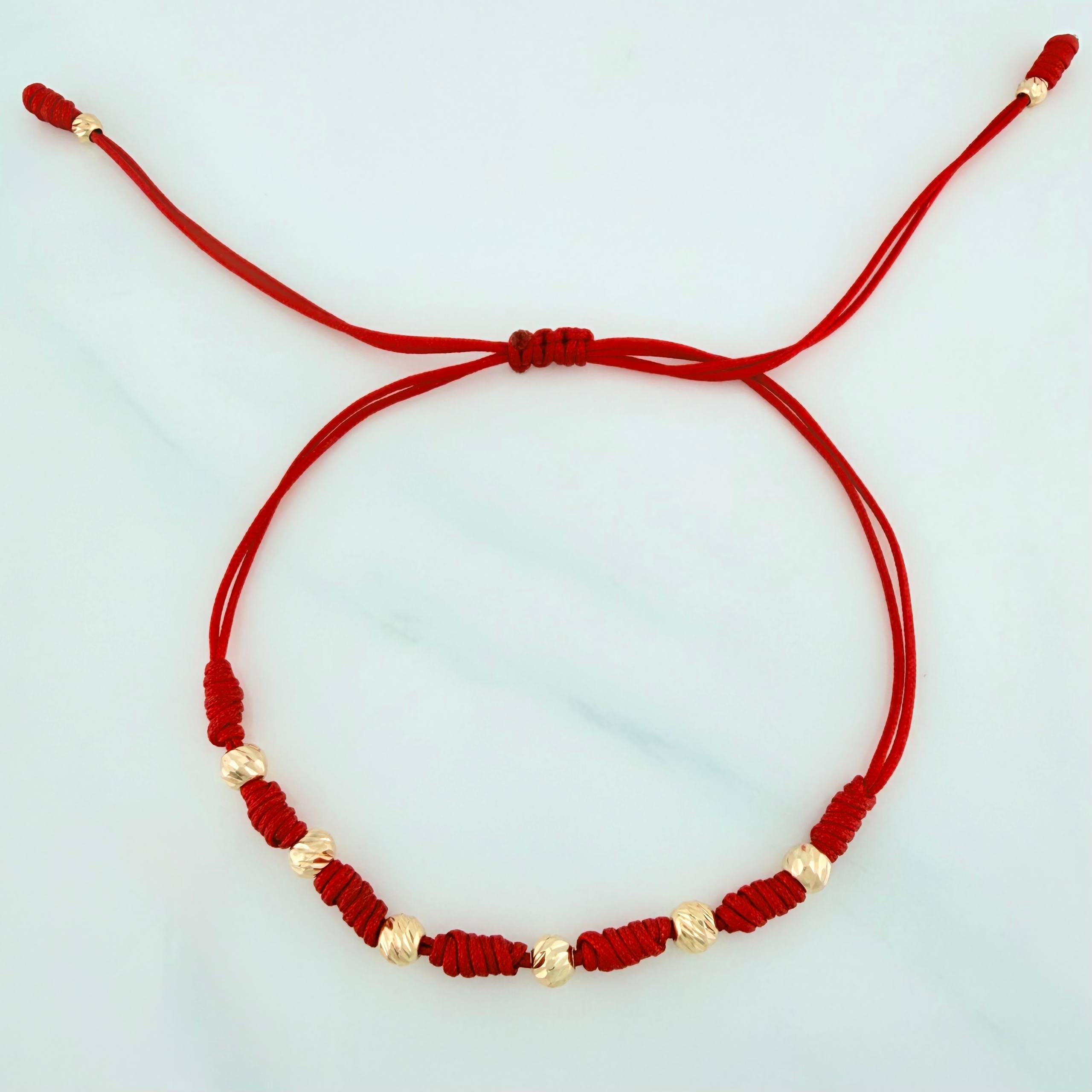 Pulsera Tejida Roja Bolas Diamantadas Oro Amarillo 18K