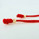 Pulsera Tejida Roja Bolas Diamantadas Oro Amarillo 18K