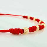 Pulsera Tejida Roja Bolas Diamantadas Oro Amarillo 18K