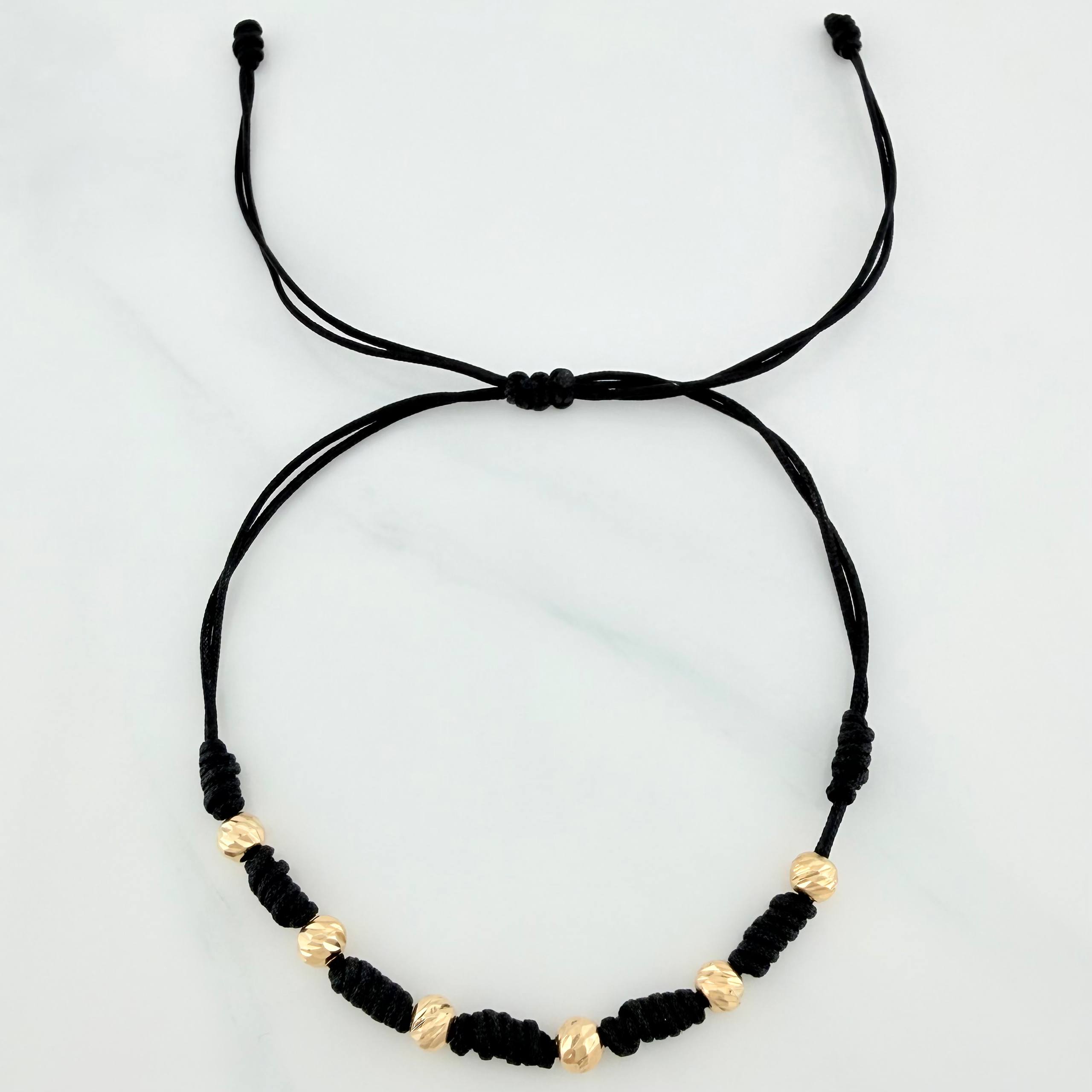 Pulsera Tejida Negra Bolas Diamantadas Oro Amarillo 18K