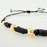 Pulsera Tejida Negra Bolas Diamantadas Oro Amarillo 18K