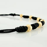 Pulsera Tejida Negra Bolas Diamantadas Oro Amarillo 18K