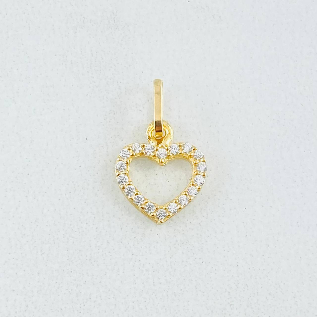 Dije Silueta Corazón Tupido 0.4gr / 1.3cm / Oro Amarillo 18K