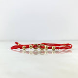 Pulsera Roja Infinito Atravezado 0.8gr / 4mm-3mm Bolas Lisas 6 und Oro Amarillo *