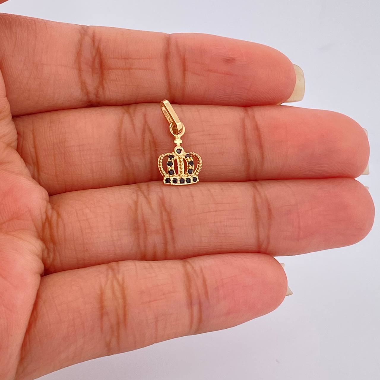 Dije Corona Real 0.75gr / 1.7cm-Oro Amarillo 18K $