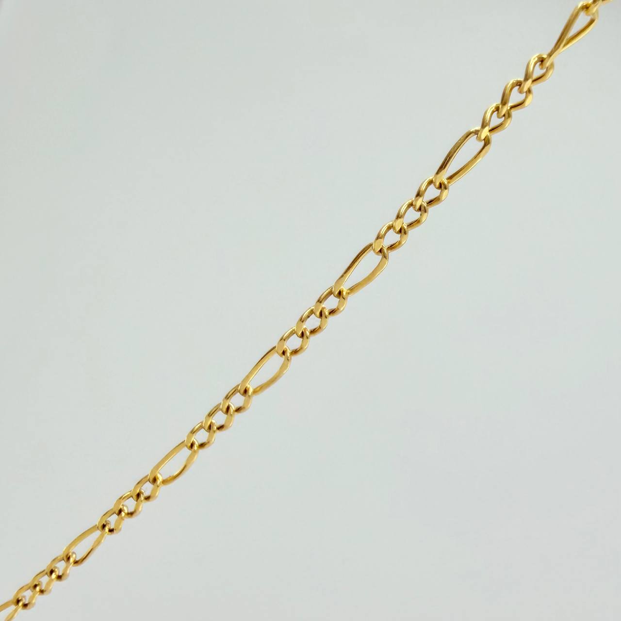 Set Cadena y Dije Figaro + Cruz 1.4gr / 50cm / 1.25mm Oro Amarillo 18K (Oferta) $