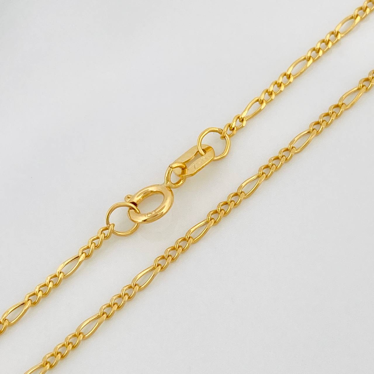 Cadena Figaro 1.85gr / 60cm / 1.15mm Oro Amarillo +1 18K $