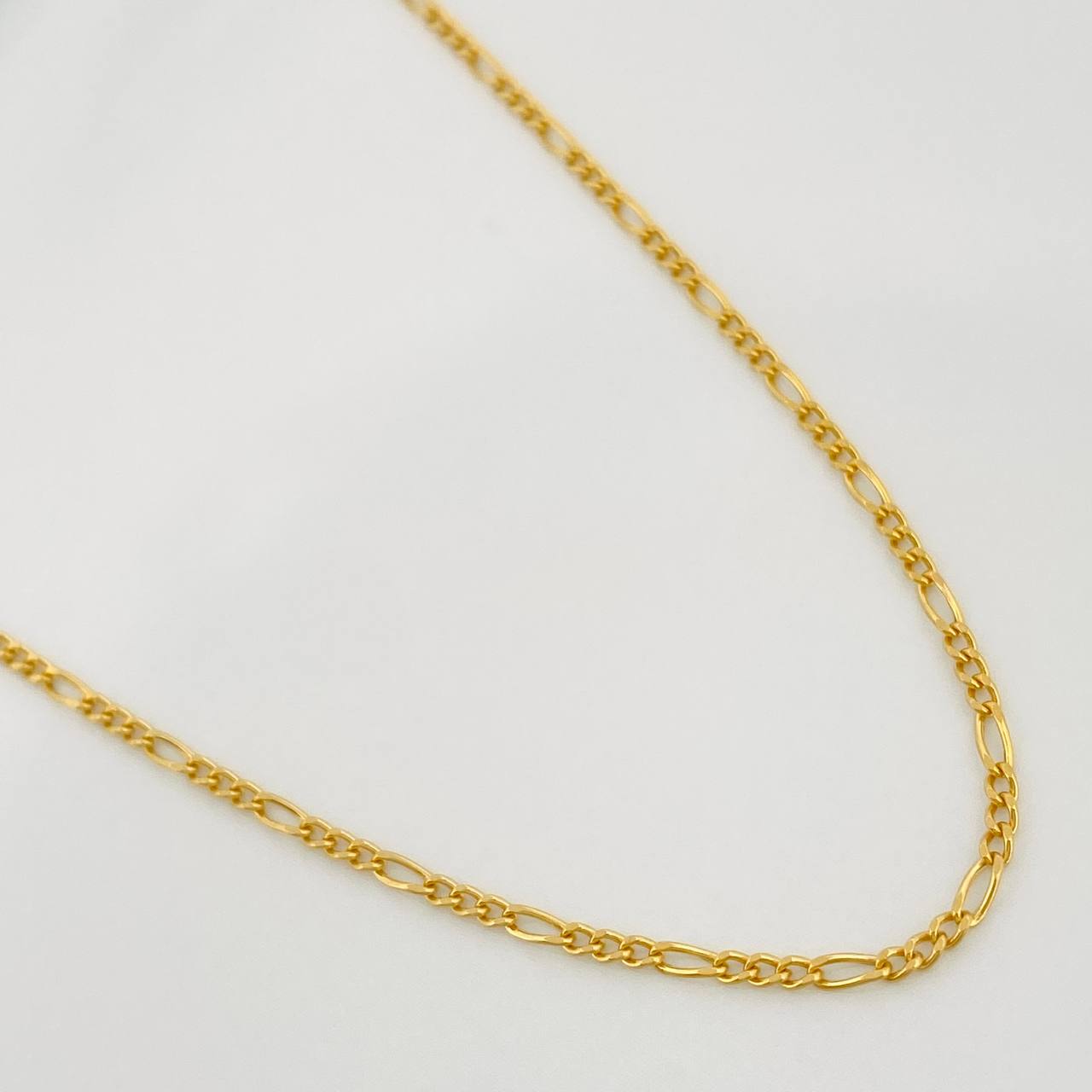 Cadena Figaro 2.45gr / 60cm / 1.6mm Oro Amarillo +1 18K $