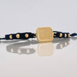 Pulsera Tejida Negra Placa Cuadrada Oro Amarillo 18K