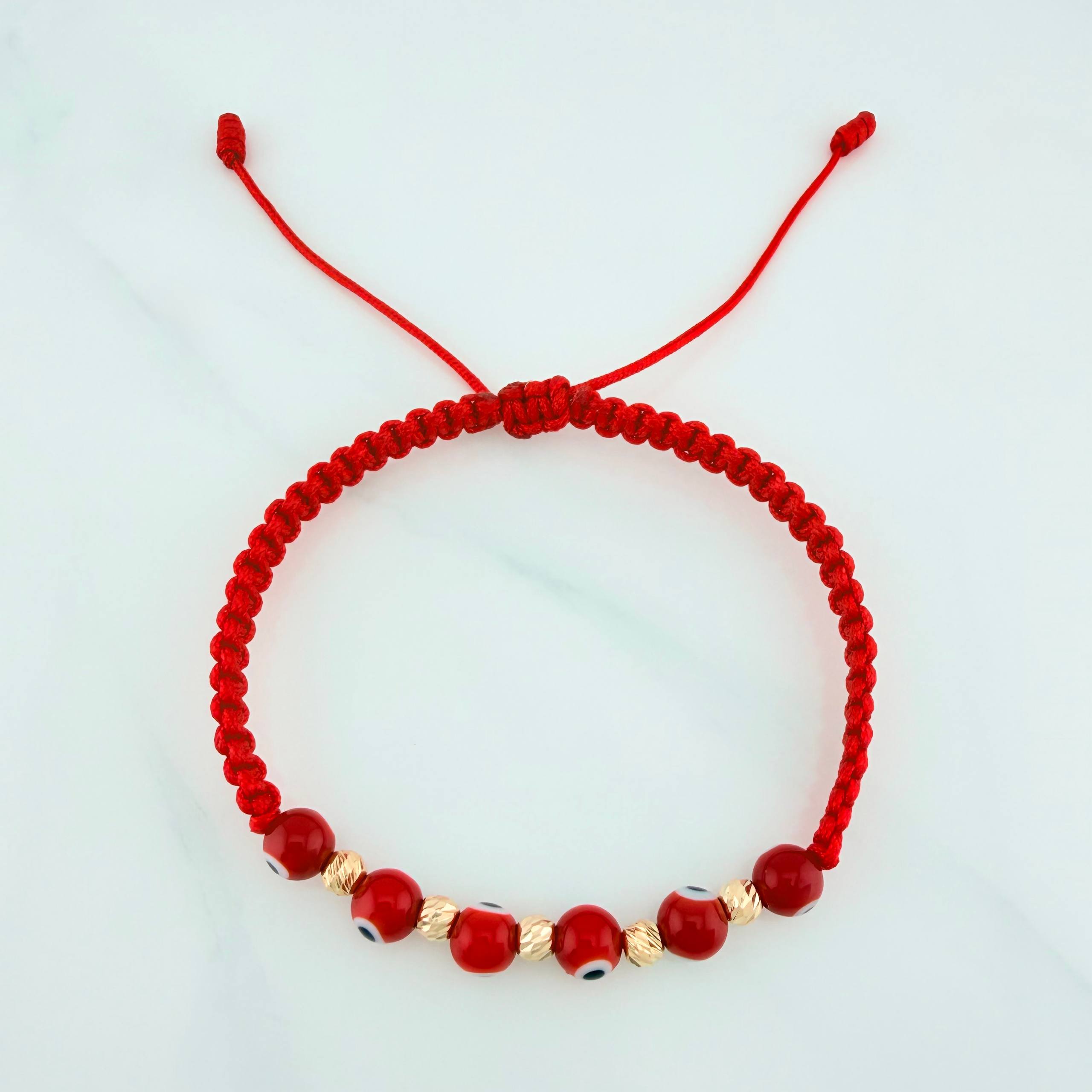 Pulsera Tejida Roja Ojos Turcos Bolas Diamantadas 5Und Oro Amarillo 18K