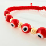 Pulsera Tejida Roja Ojos Turcos Bolas Diamantadas 5Und Oro Amarillo 18K