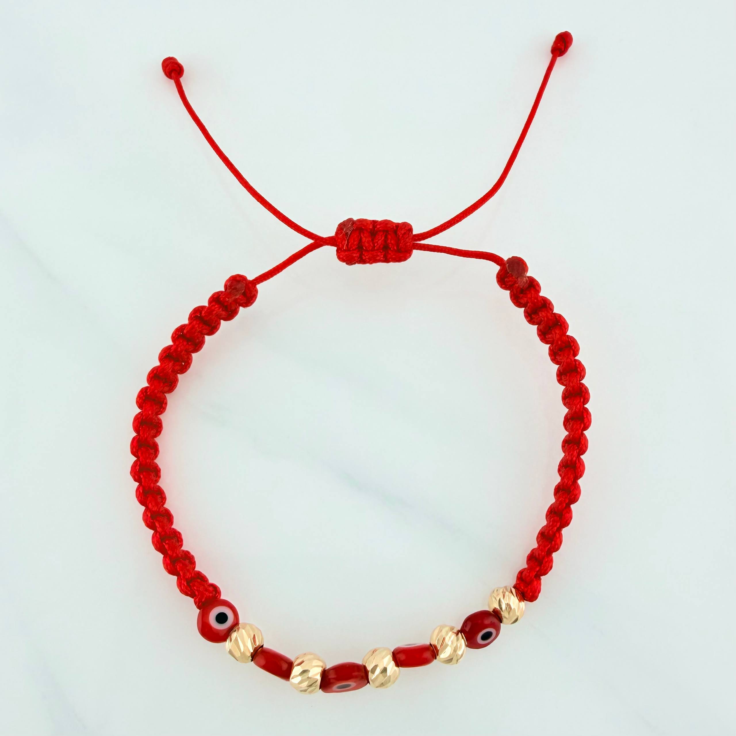 Pulsera Tejida Roja Ojos Turcos Bolas Diamantadas 5Und Oro Amarillo 18K