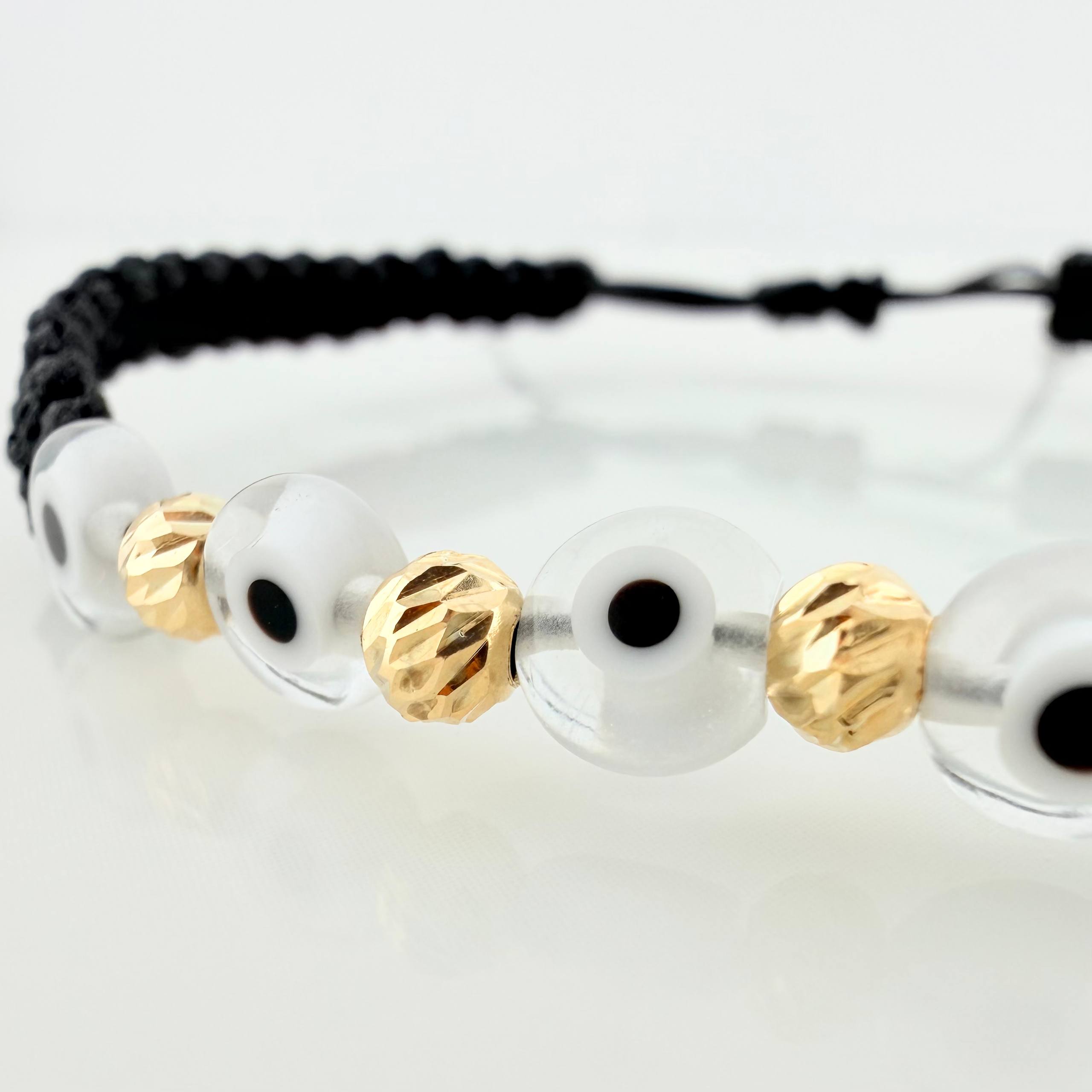 Pulsera Tejida Negra Ojos Turcos Blancos Bolas Diamantadas 5Und Oro Amarillo 18K