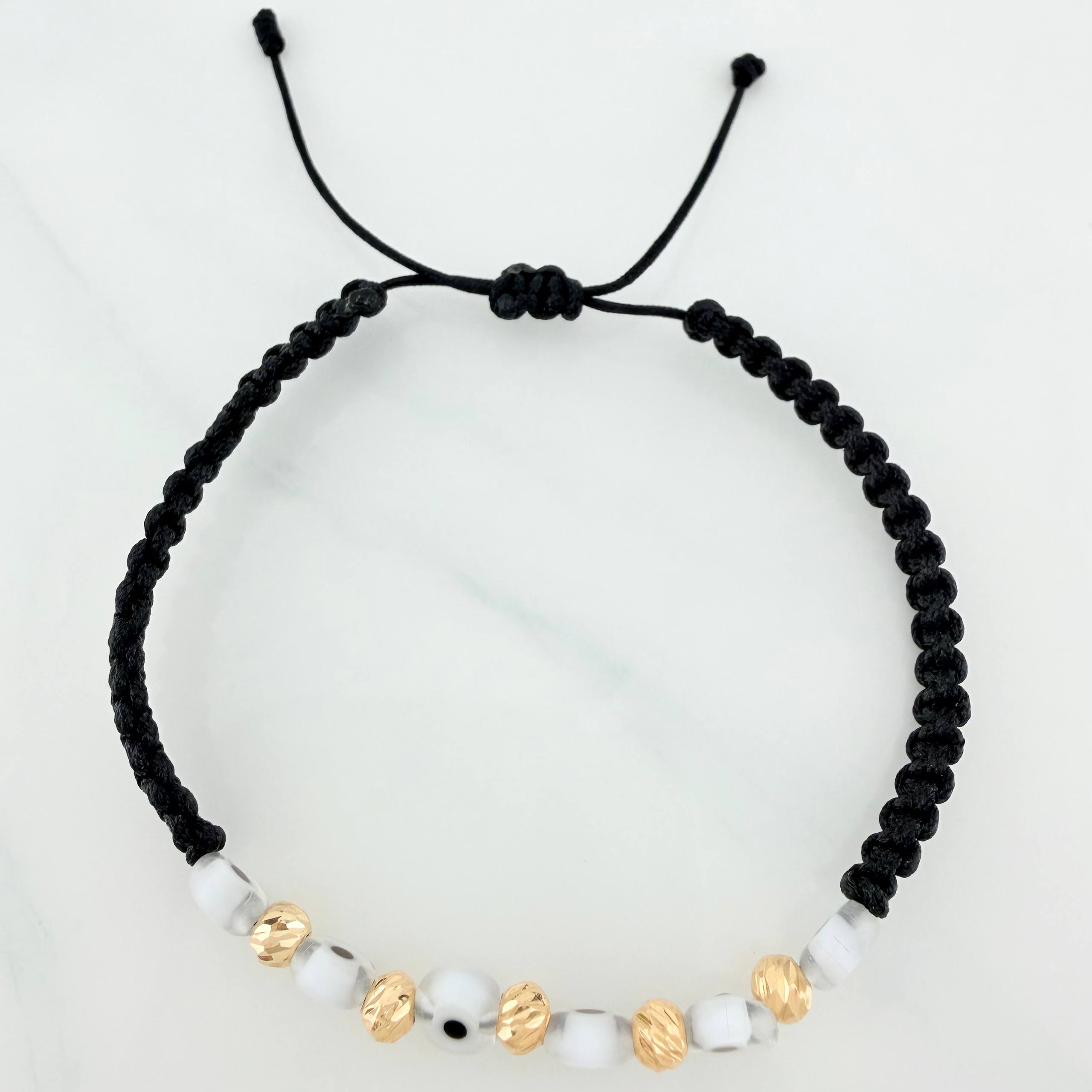 Pulsera Tejida Negra Ojos Turcos Blancos Bolas Diamantadas 5Und Oro Amarillo 18K