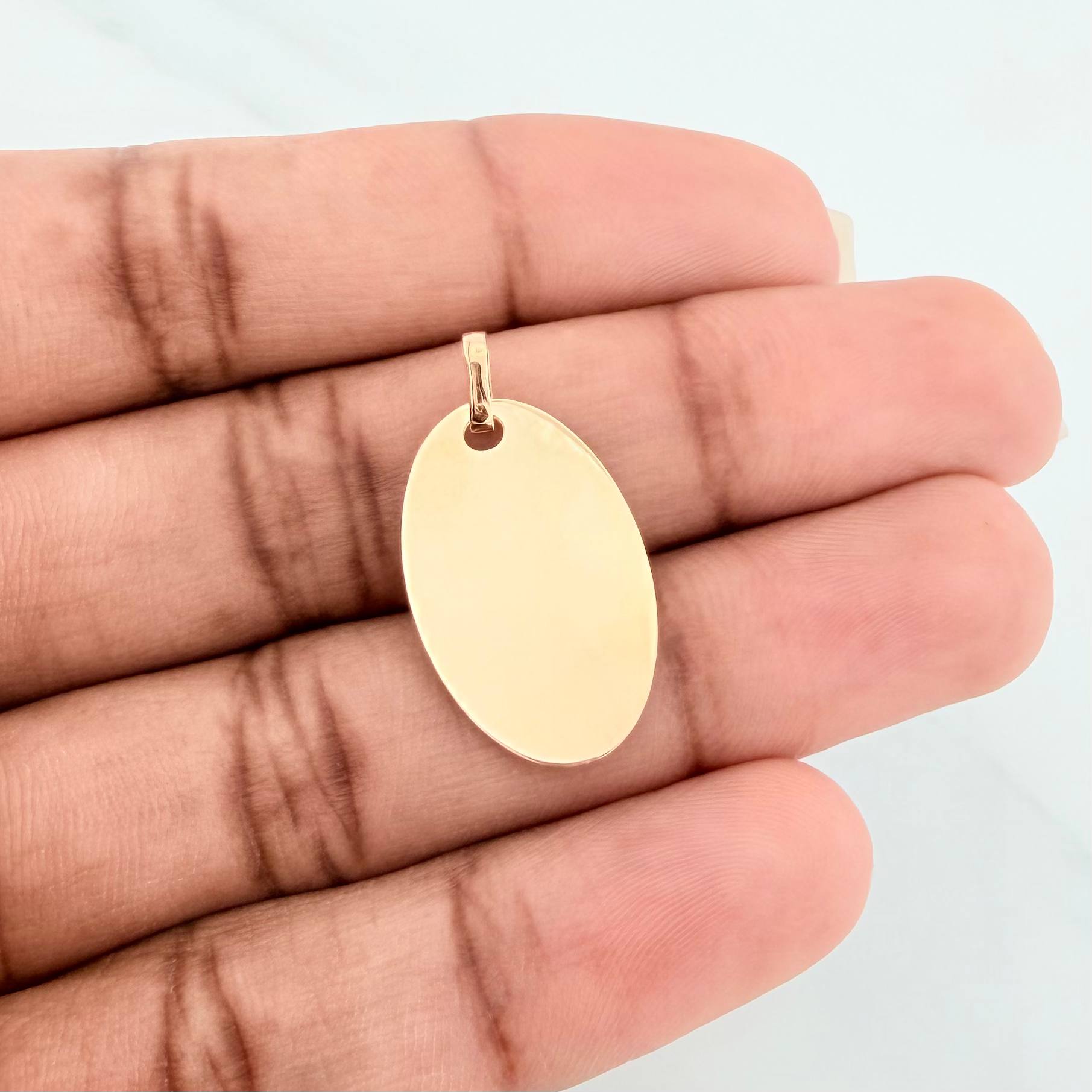 Dije Placa Ovalada 1.2 g / 2.5 cm Oro Amarillo 18K
