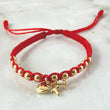 Pulsera Roja Dije Tres Gracias 1.65gr / 4mm Bolas Lisas 12 und Oro Amarillo 18K  ©