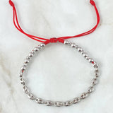 Pulsera Roja Retazo GC 2.85gr / 3mm-4mm Bolas Lisas 10 und Diamantadas 8 und Oro Blanco 18K ©