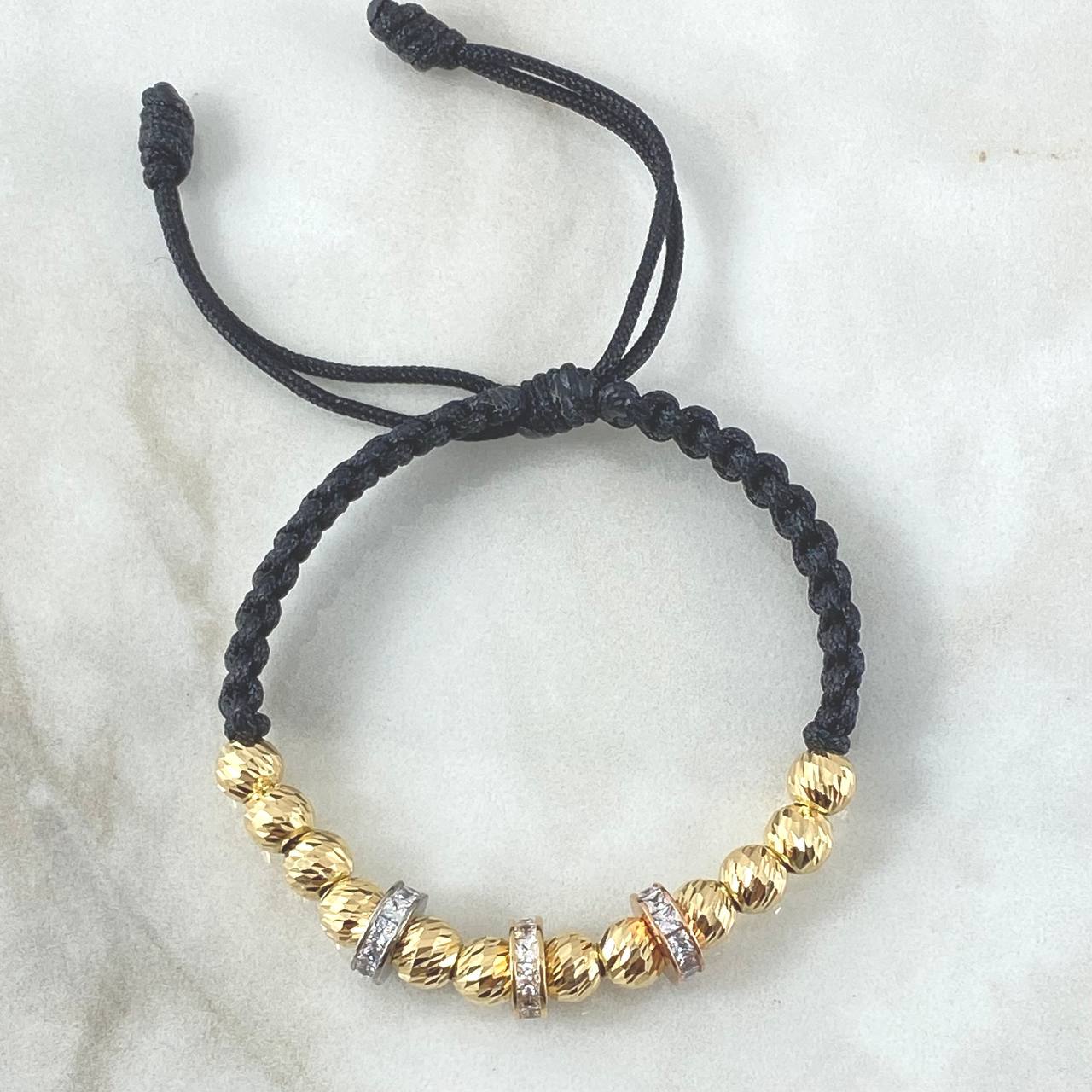 Pulsera Negra Herraje Rueda 6gr / 6mm Bolas Diamantadas 12 und Circones Blancos Tres Oros 18K ©