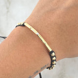 Pulsera Negra Herraje Cilindro Trio De Clavos 1.7gr / 4mm Bolas Diamantadas 12 und Tres Oros 18K ©