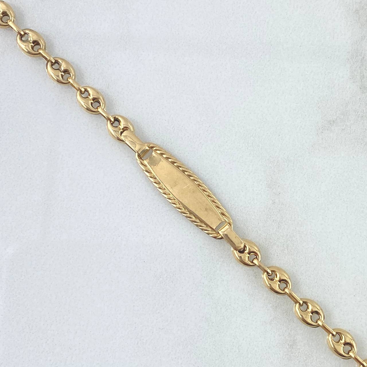 Pulso Bebé GC Placa Ovalo 2.55gr / 15.5cm / 4.5mm Rayado Bordeado Oro Amarillo