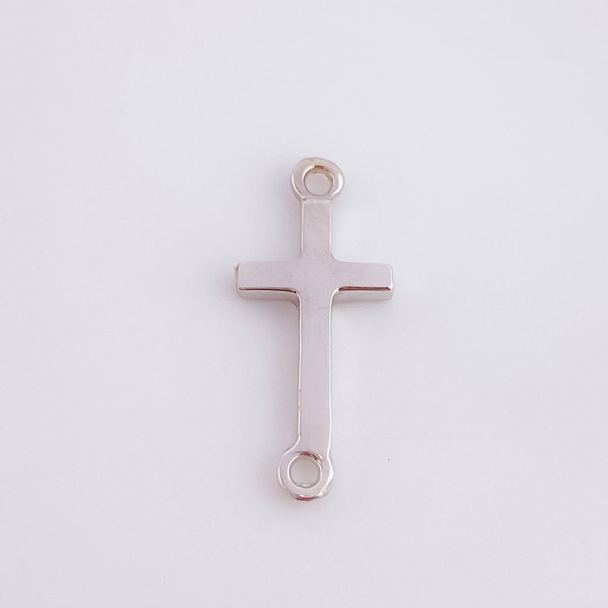 Herraje Cruz 0.75gr / 1.8cm / Oro Blanco 18K ©