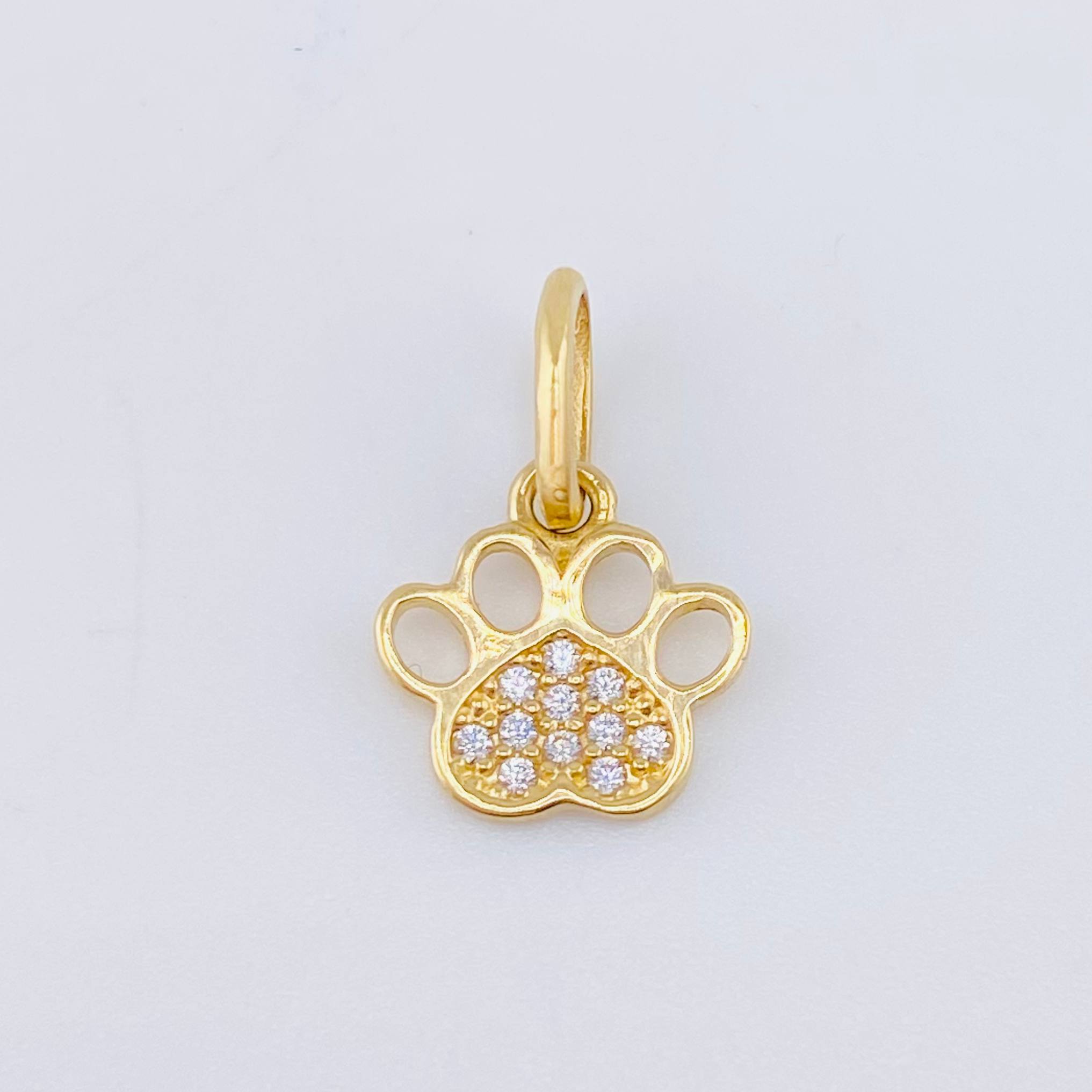 Dije Huella 0.7gr / 1.5cm / Oro Amarillo 18K ©