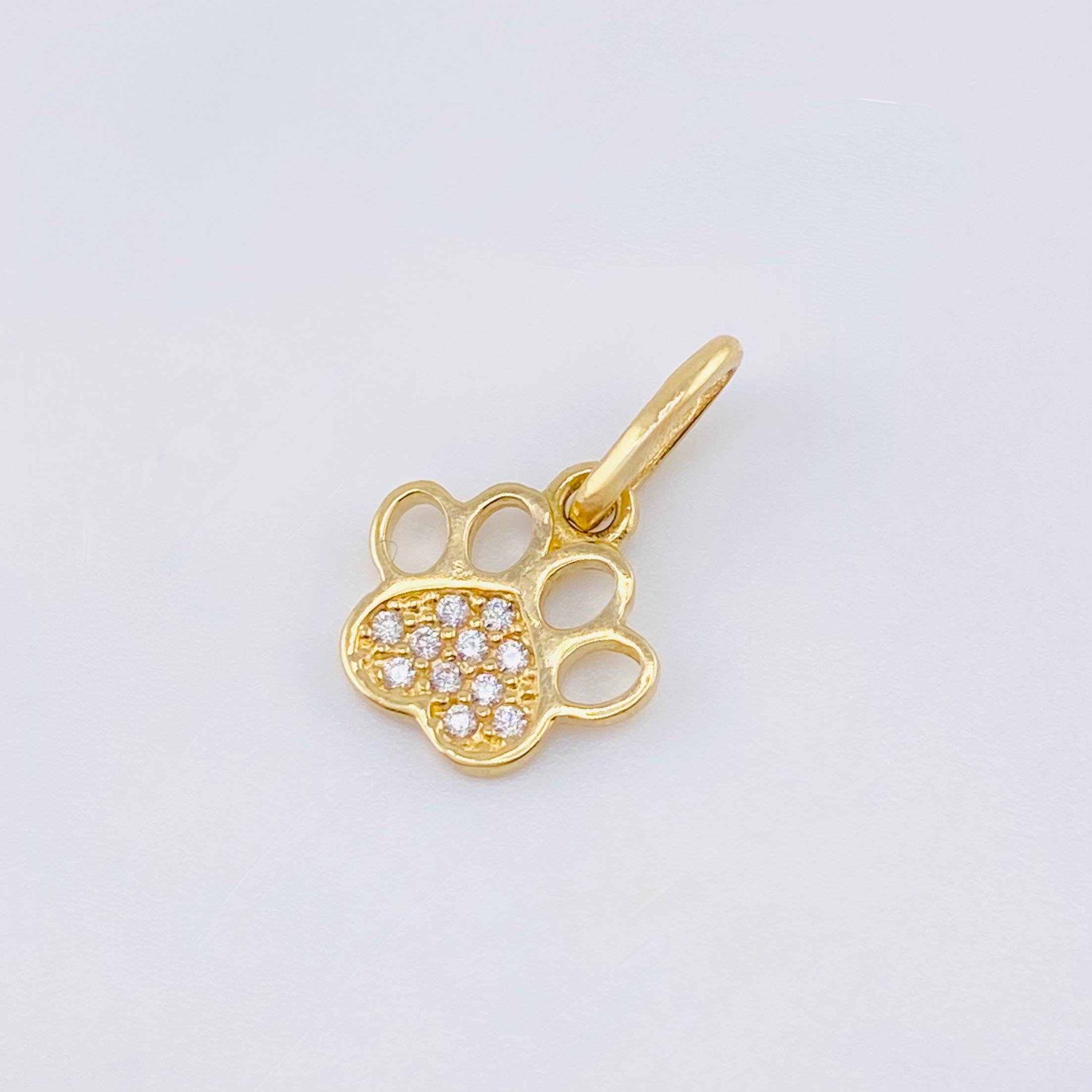 Dije Huella 0.7gr / 1.5cm / Oro Amarillo 18K ©