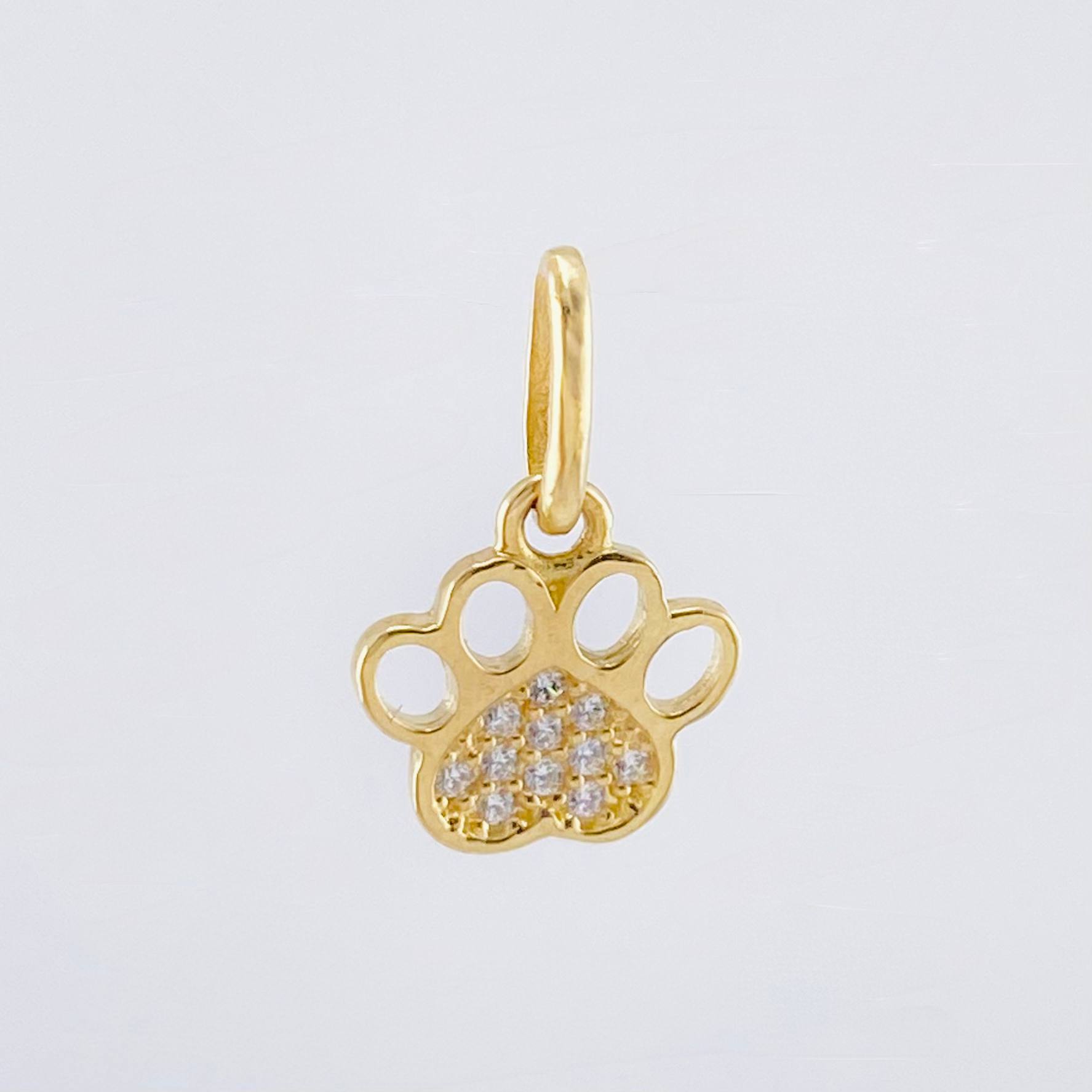 Dije Huella 0.7gr / 1.5cm / Oro Amarillo 18K ©