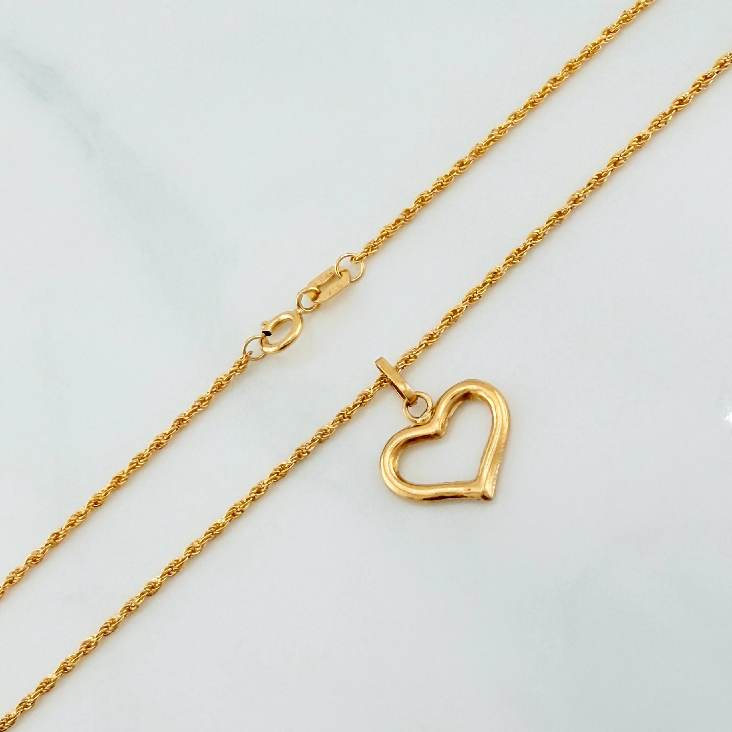 Set Cadena Lazo + Dije Silueta Corazon / 1,45 gr / 50 cm Oro Amarillo 18K
