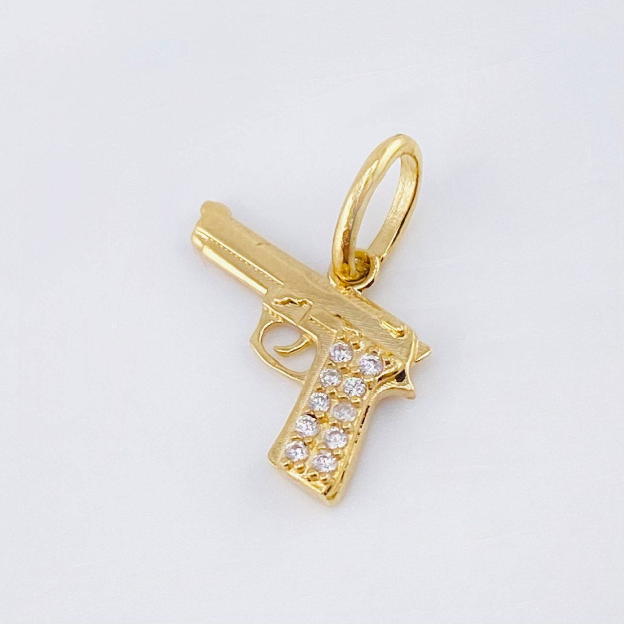 Dije Pistola 1.15gr / 1.5cm / Oro Amarillo 18K ©