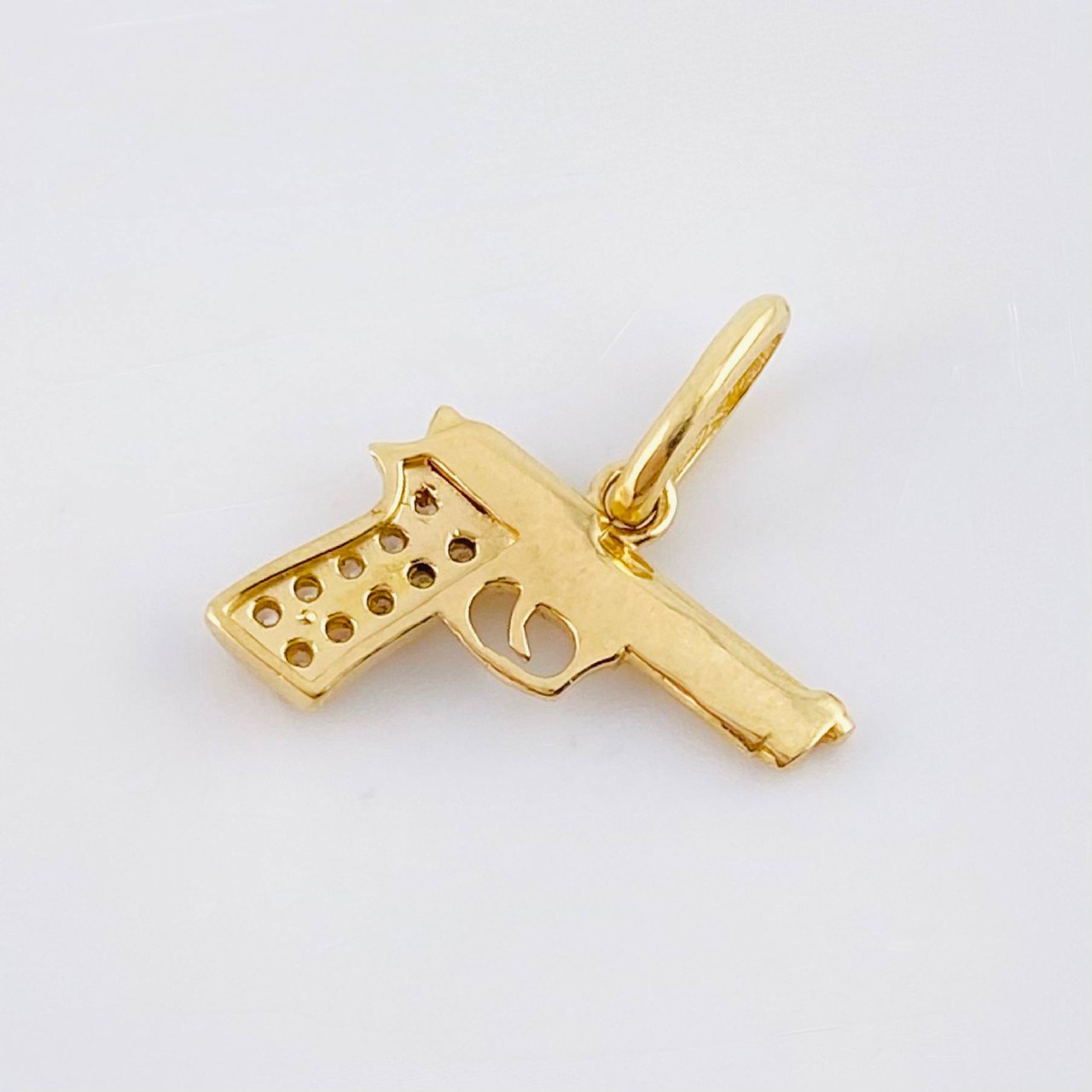Dije Pistola 1.15gr / 1.5cm / Oro Amarillo 18K ©