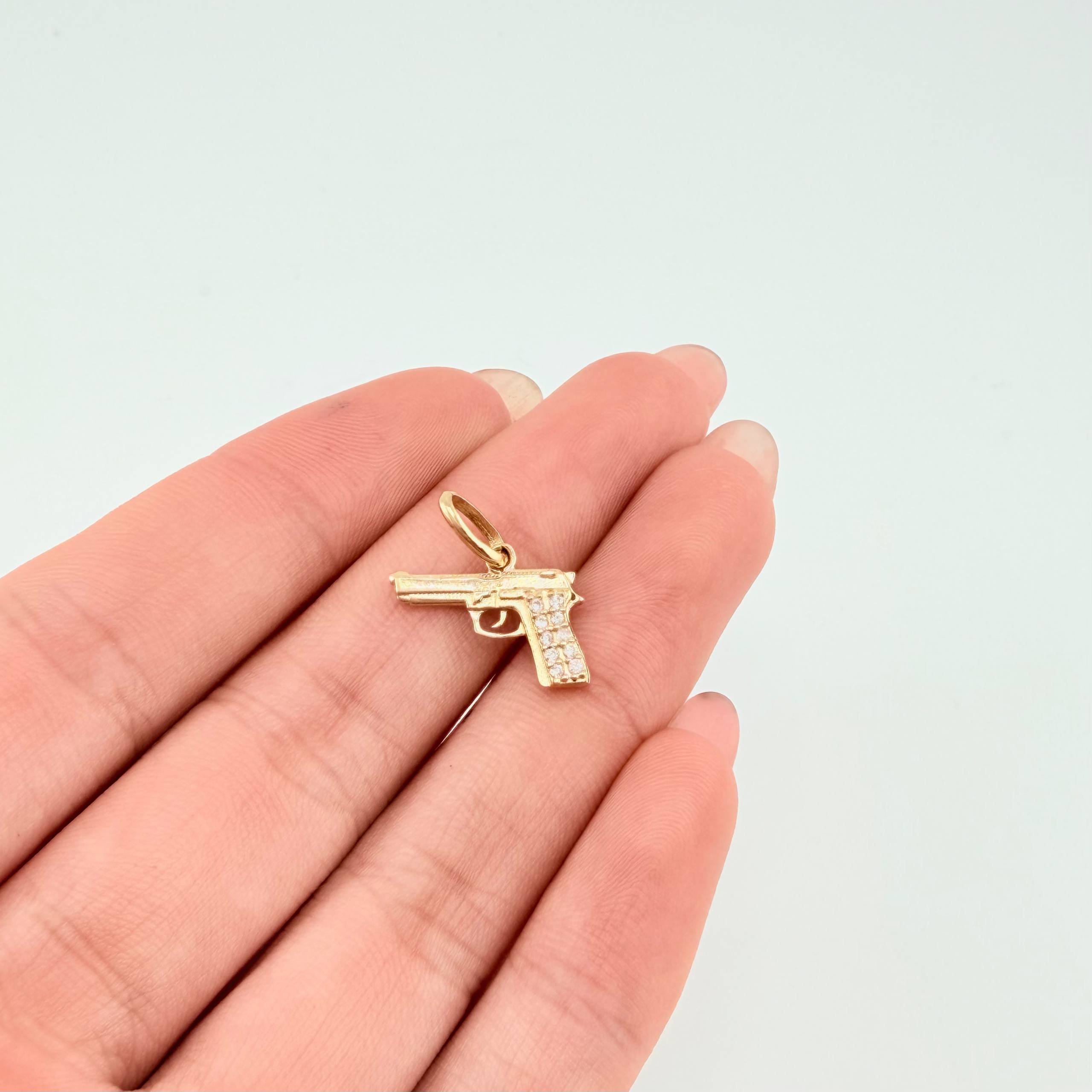 Dije Pistola 1.15gr / 1.5cm / Oro Amarillo 18K ©