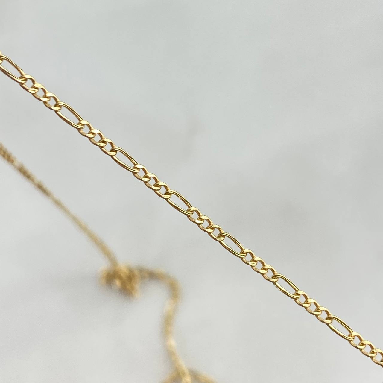 Cadena Figaro 1.25gr / 50cm / 1.5mm Oro Amarillo +1 *