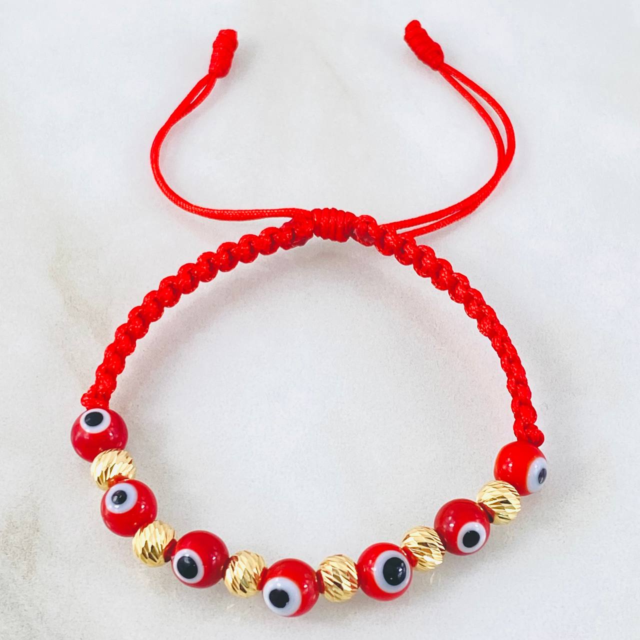 Pulsera Roja Ojos Turcos  1.1gr / Oro Amarillo 18K (A.C)