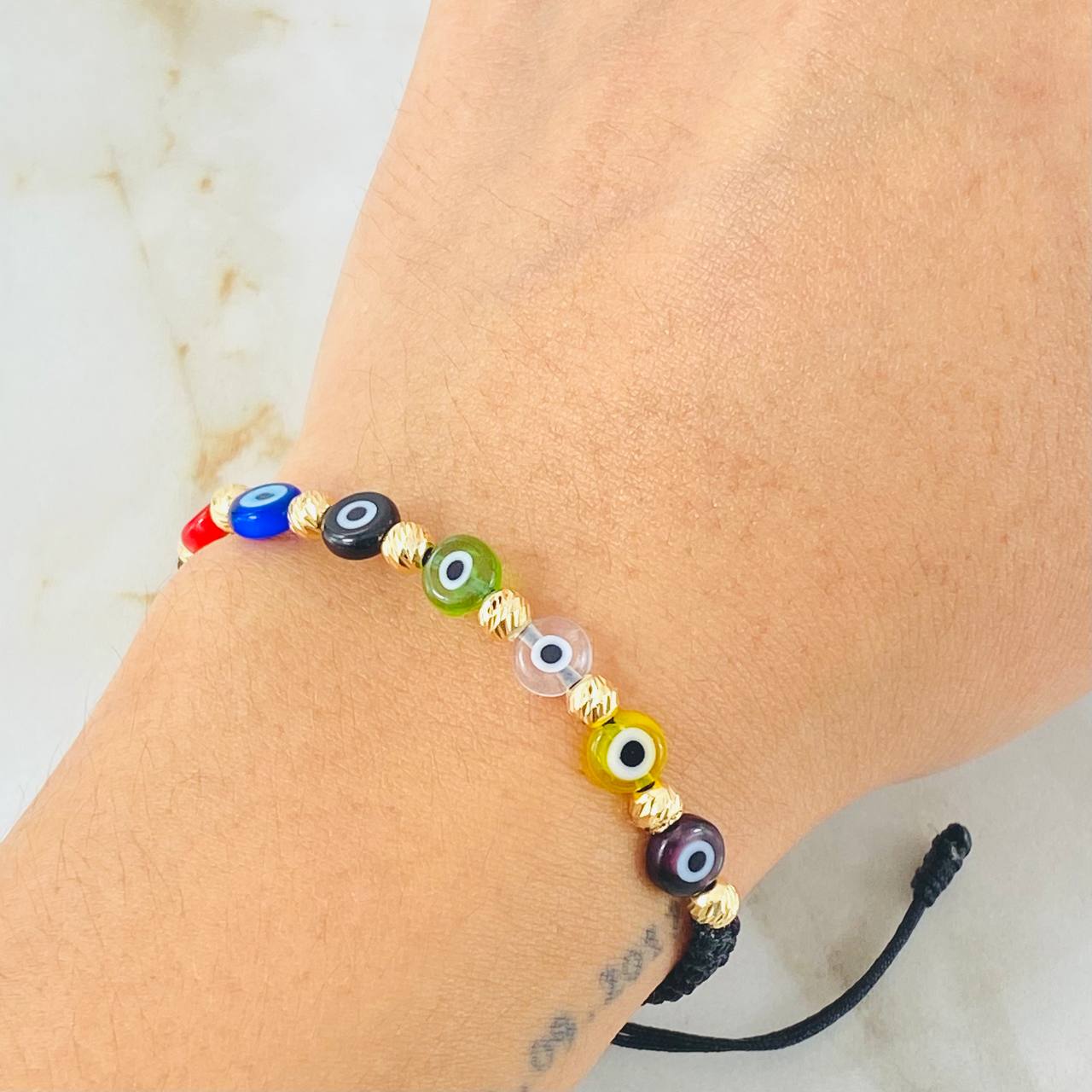 Pulsera Negra Ojos Turcos Colores 0.85gr / Oro Amarillo 18K (A.C)