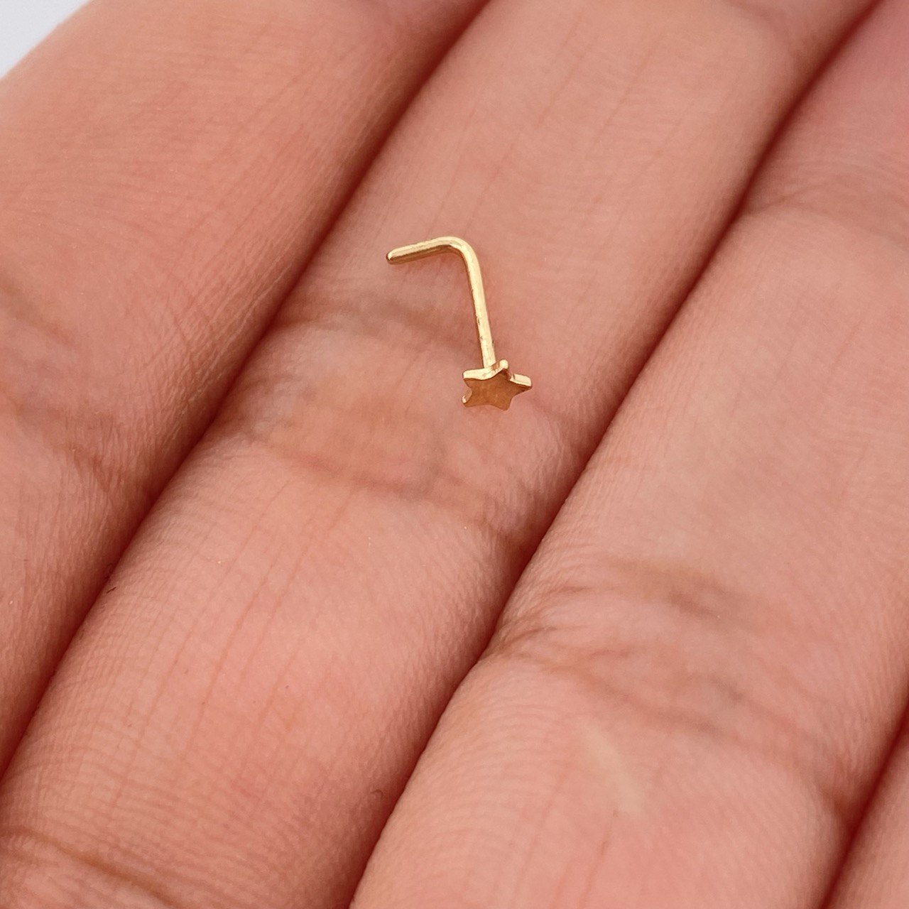 Piercing Chispa Estrella 0.1gr / 0.9cm / Oro Amarillo 18K $