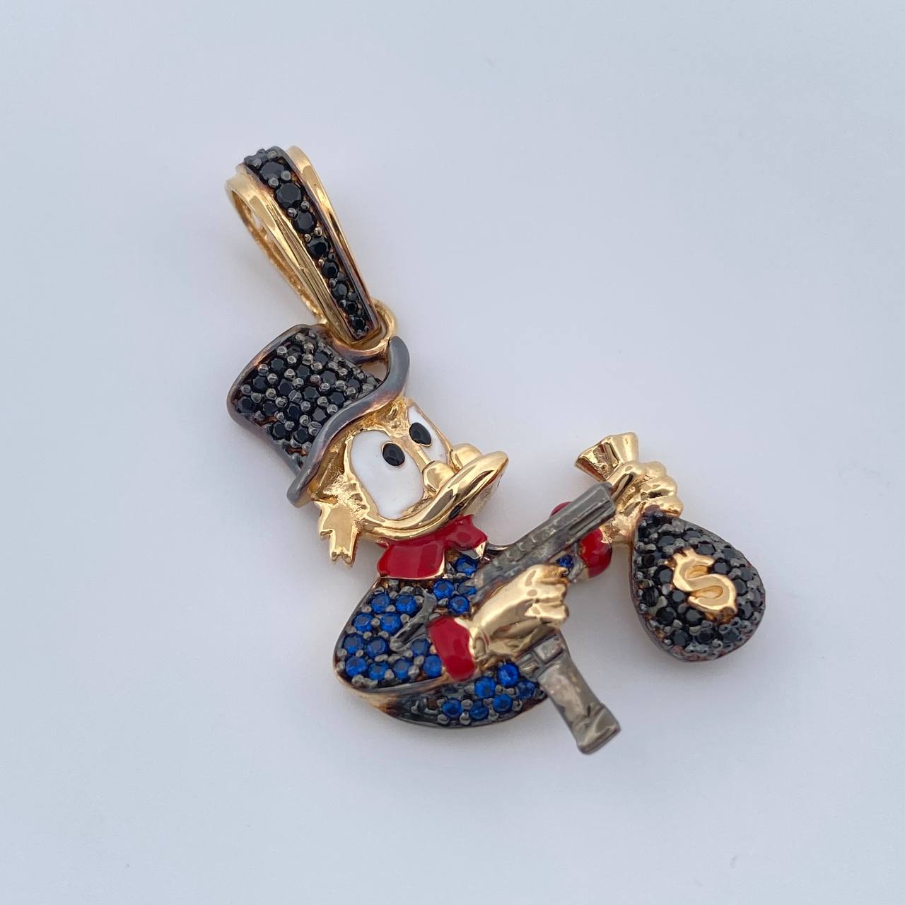 Dije Pato Pistola 6.05gr / 3.7cm / Dos Oros Negro Amarillo 18K $
