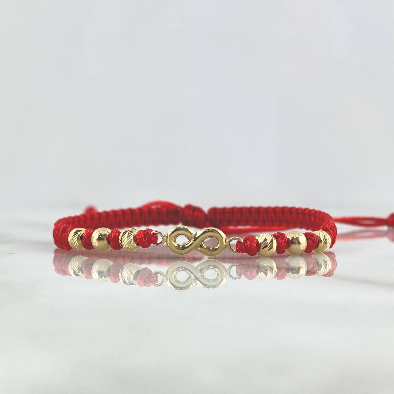 Pulsera Roja Infinito 1gr / 4mm Bolas Lisas Diamantadas 6 und Oro Amarillo ©