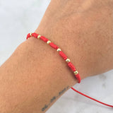 Pulsera Roja Anudada 0.35gr / 3mm Bolas Lisas 6 und Oro Amarillo *